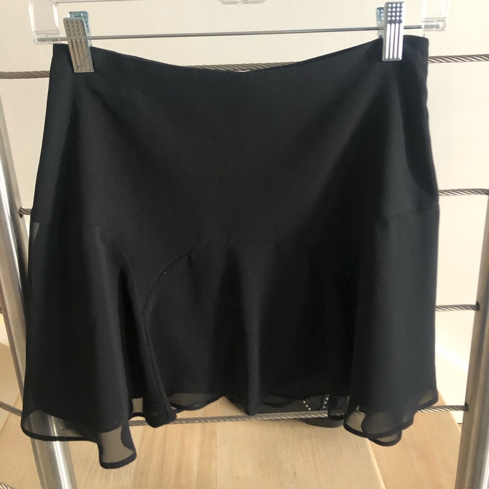 Black mini skirt, sheer flutter over black lining
